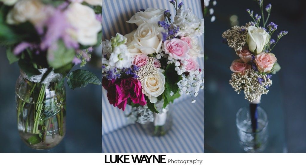 Three floral arrangements: one in a mason jar, one bouquet, one boutonniere; various light pink and white flowers.