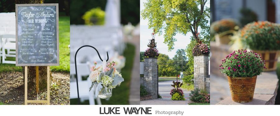 Wedding decor: chalkboard sign, chairs with flower bouquets, stone pillars, and potted plants.