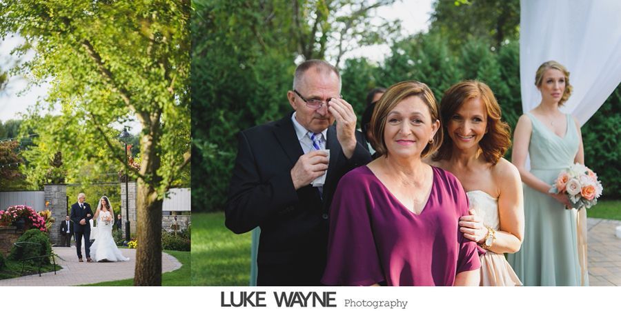 Wedding scene: father wiping a tear, bride and bridesmaid, ceremony setting.