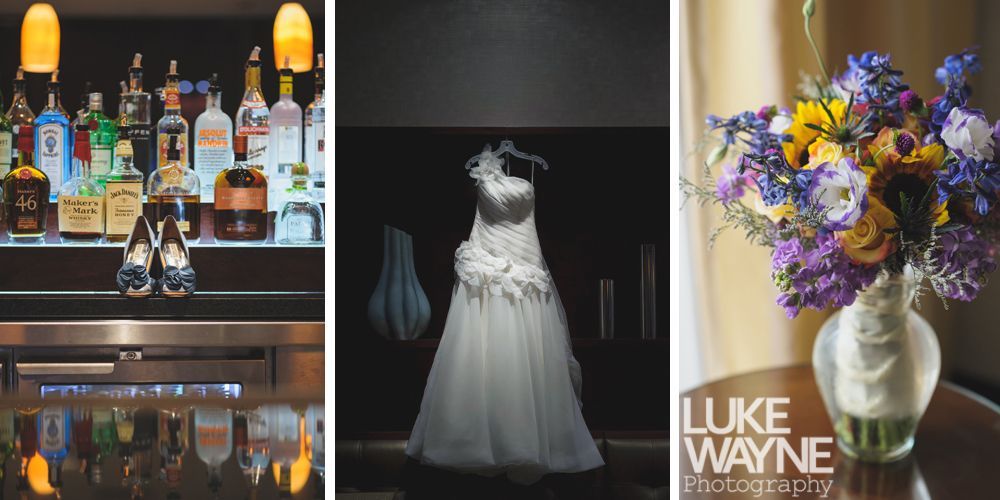 Woman laughs joyfully outdoors, hand in hair, wearing denim jacket and floral dress.