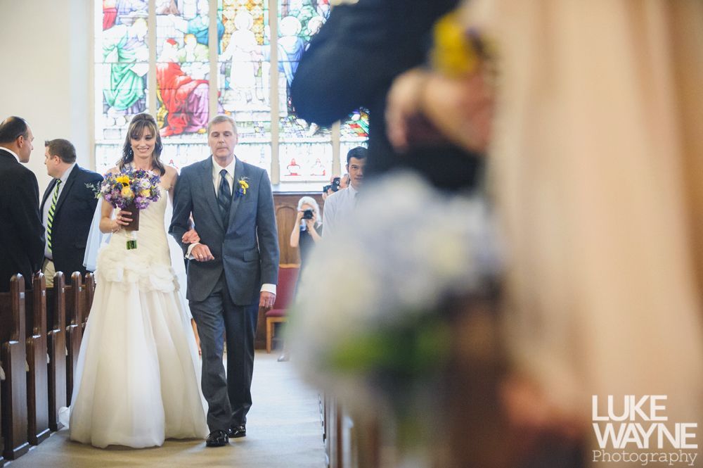 Couple touching noses, silhouetted against a bright background; romantic moment.