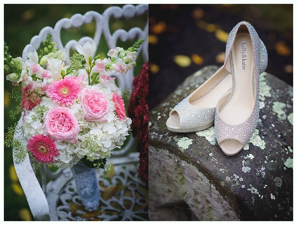 Bridal bouquet of pink and white flowers on a white chair next to sparkly, open-toe shoes on a mossy surface.