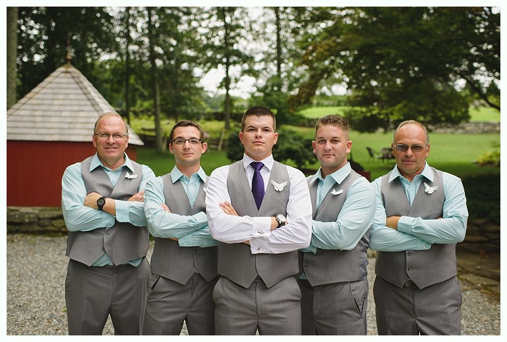 Woman smiling, embracing a man with a beard, intimate moment, black and white photo.