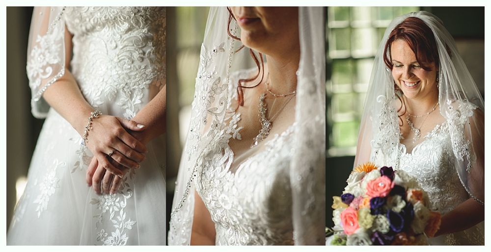 Couple embracing, smiling outdoors; woman in white dress, man in blue shirt, dark background.