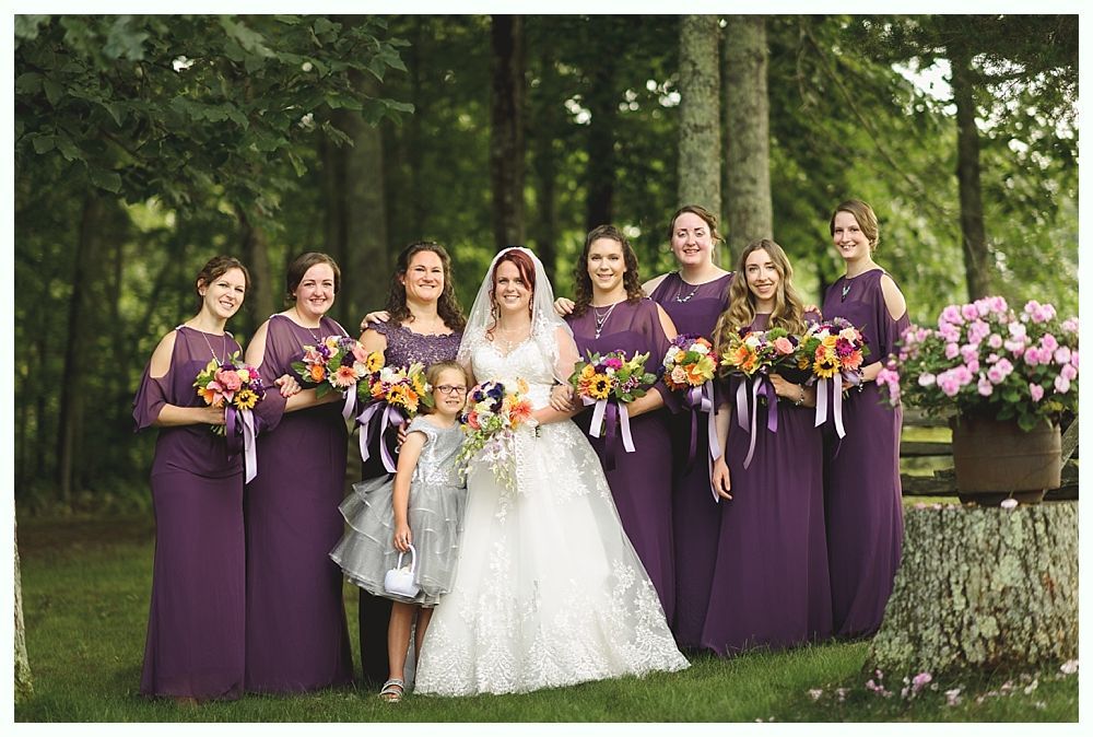 Couple standing under large tree in foggy park. Black and white photo.
