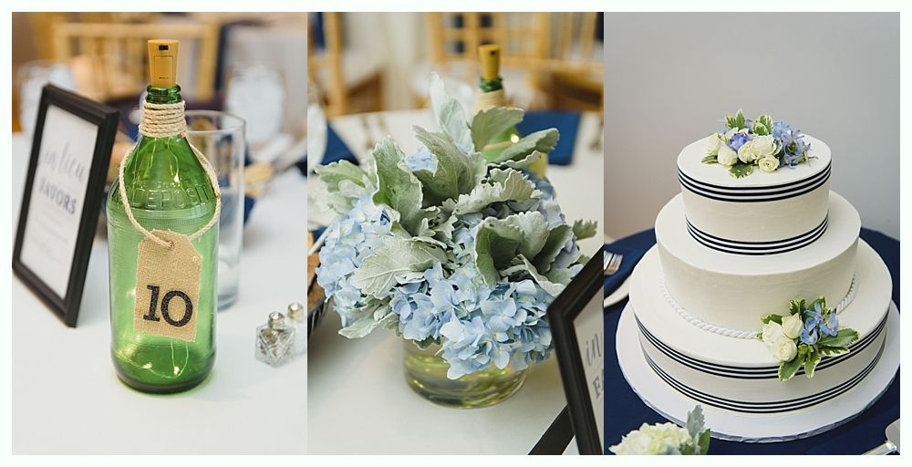 Wedding table decor: green bottle with table number, blue hydrangea centerpiece, white cake with blue ribbon.
