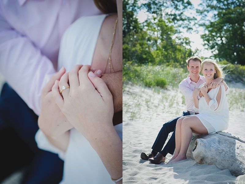Couple walking and holding hands in a field; the woman in a red and gold dress, the man in a black vest.