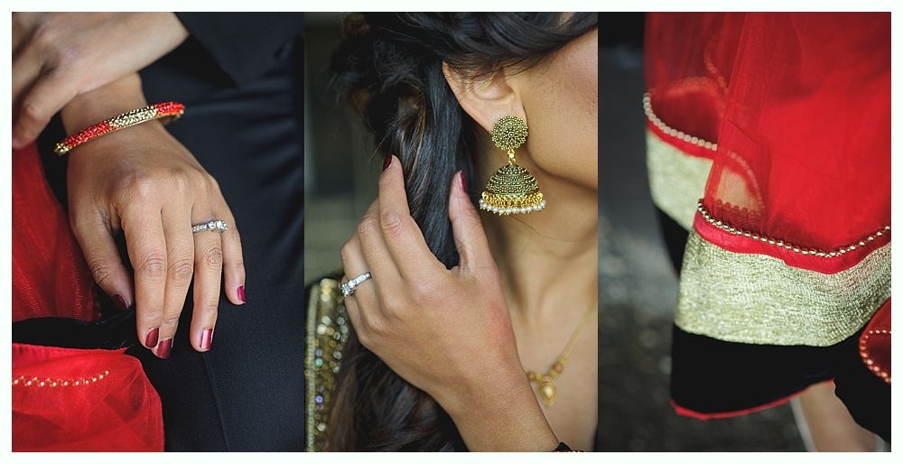 Woman's hands with jewelry: ring, bracelet, and earrings, next to red and gold fabric.