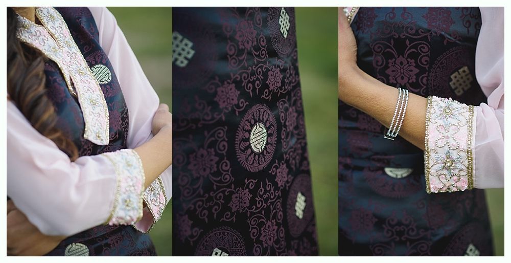 Woman in traditional dark purple brocade clothing with silver trim and bracelets.