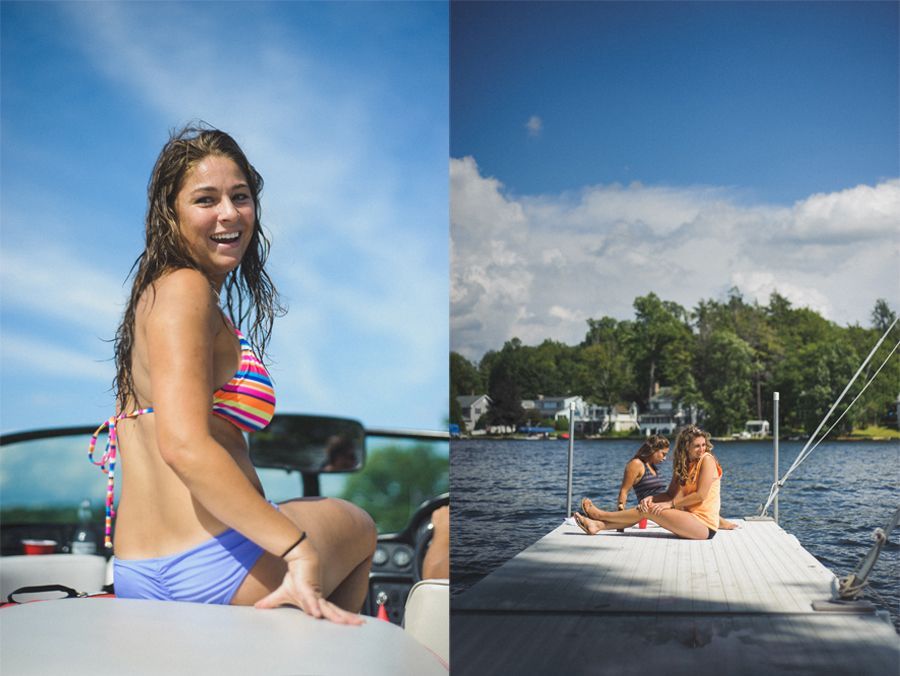 Bride and groom under umbrella, backlit by light. Mountain backdrop in dark, black and white photo.