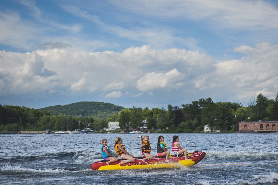 Man adjusting his suit: buttons, tie, and cufflinks. Black and white.