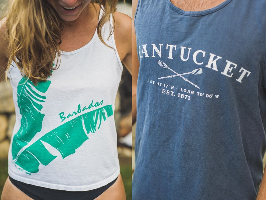 Man in suit looks out a window, checking his watch, waiting. Black and white.