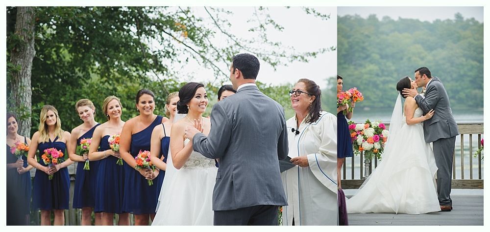 Wedding ceremony with a bride and groom, bridesmaids, and officiant outdoors by water.