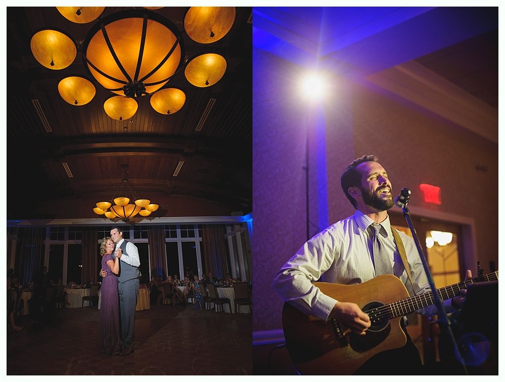Wedding reception. Couple dancing under chandelier. Musician performing, lit by spotlight. Warm and cool tones.