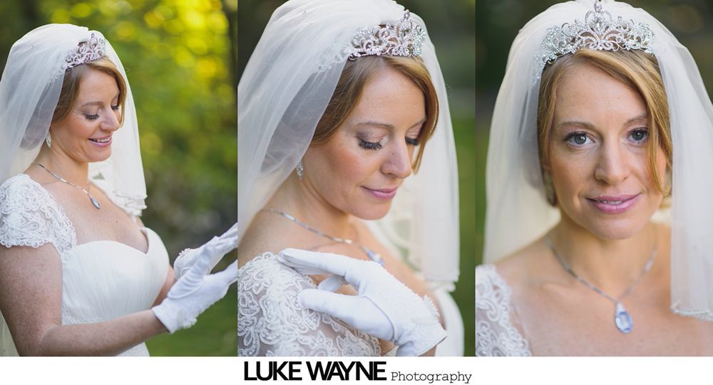 Bride and bridesmaids in teal dresses, with veil; bridesmaids smiling, indoors.