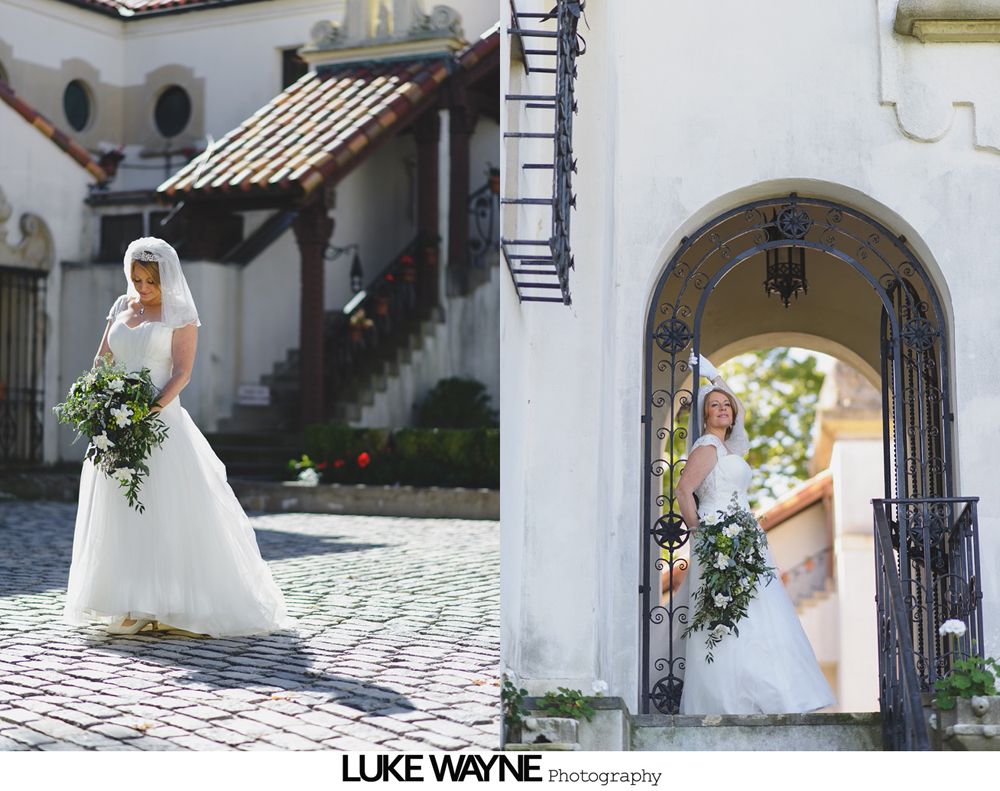 Groom and groomsmen in black suits and sunglasses pose in front of a colorful autumn landscape.