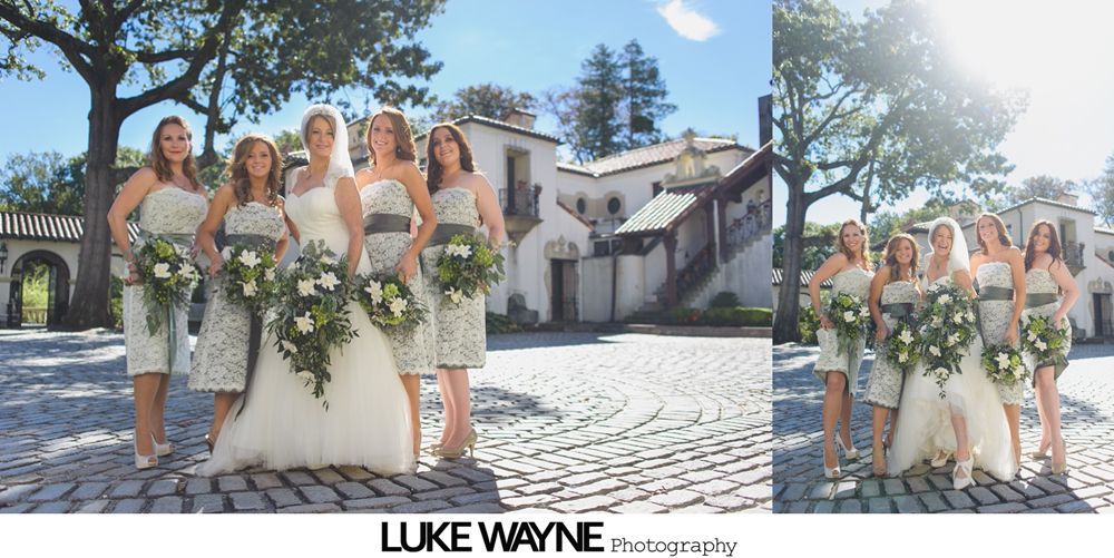 Bride in a strapless gown stands in an orchard, holding a bouquet. Black and white.