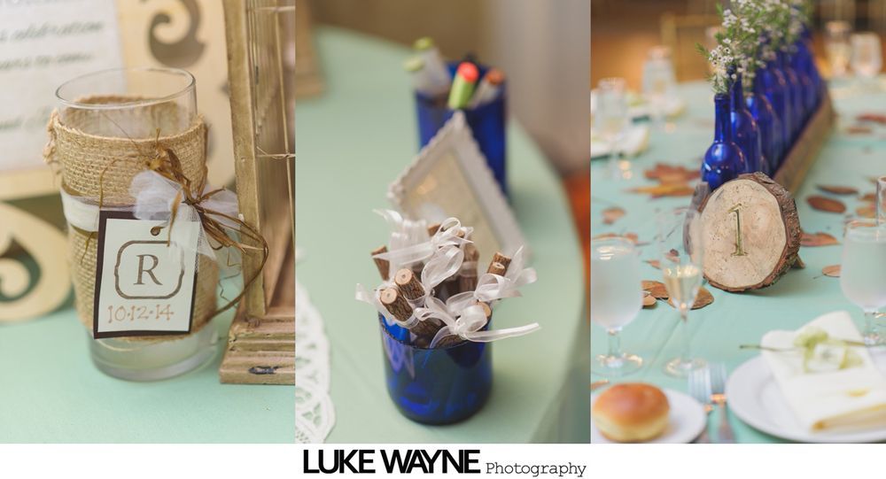 Wedding couple at night, poses near ivy-covered tower and building with string lights.