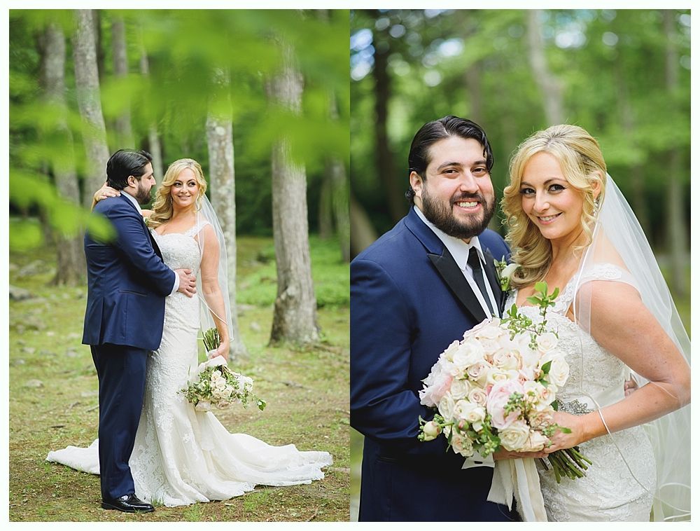 Couple in wedding attire posing outdoors; man in blue suit, woman in white dress, holding bouquet.