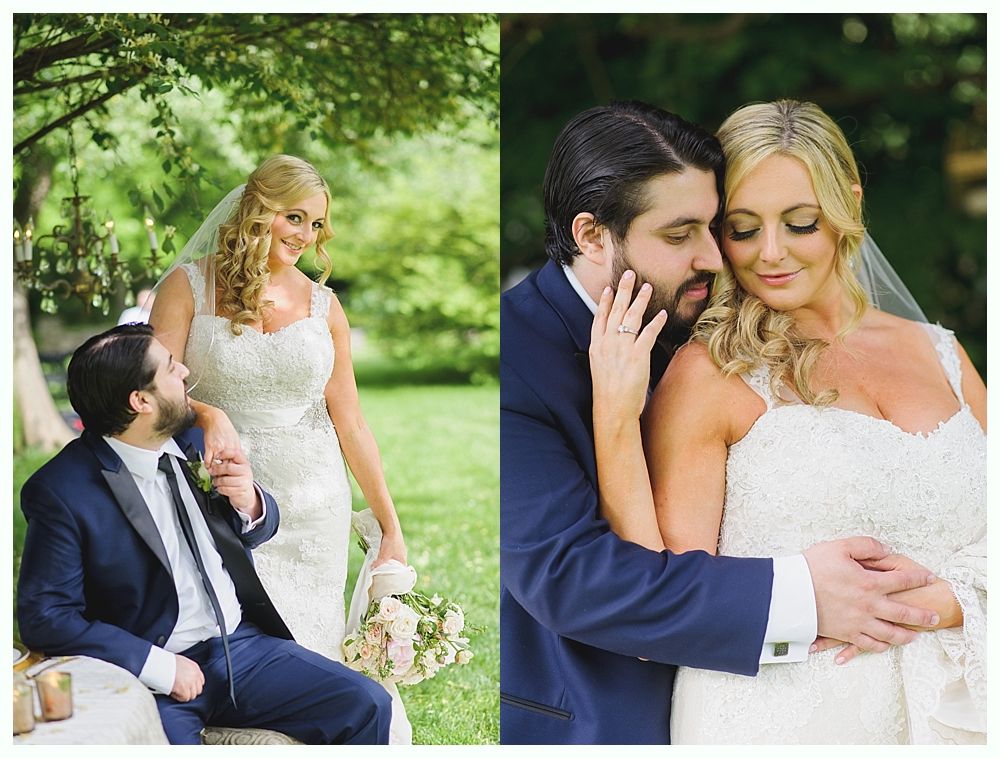 Bride and groom in a garden setting, she in a white gown, he in a blue suit.