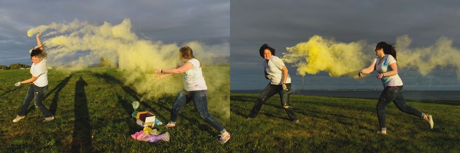 People release yellow smoke on a green field. Overcast sky.