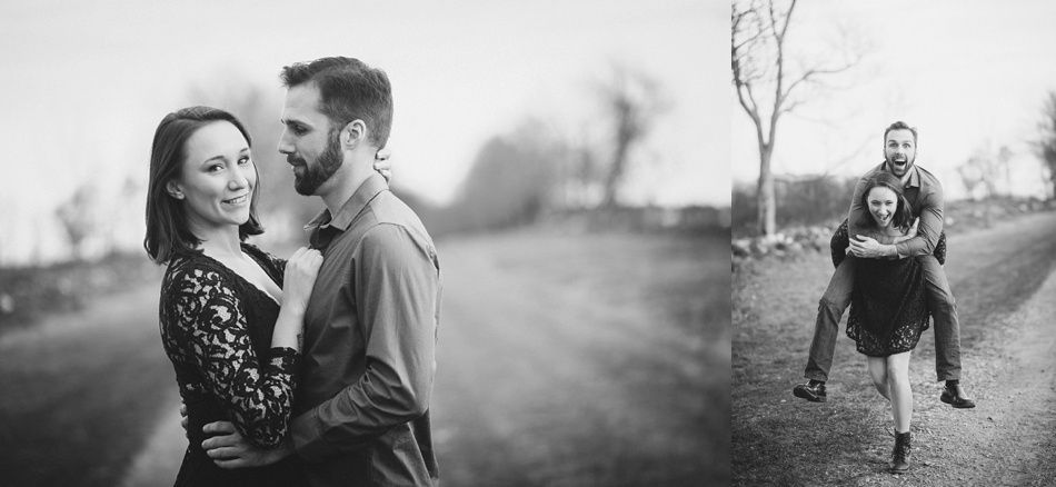 Couple posing on a dirt road. Man carries woman piggyback, both smiling. Black and white.