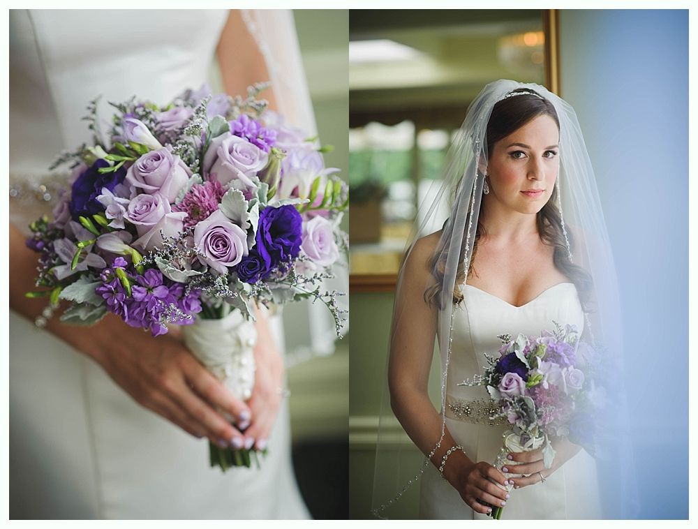 Bride holding purple floral bouquet, wearing a veil and white gown.