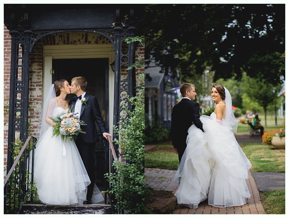 Bride and groom kissing, posed in wedding photos. She wears a white gown and veil, holding a bouquet. He wears a tuxedo. Outdoor setting.