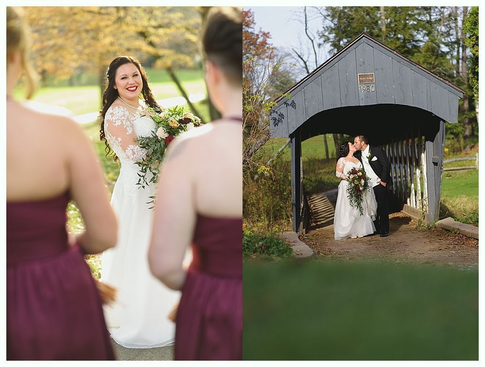 Bride with bridesmaids and groom kissing under a covered bridge.
