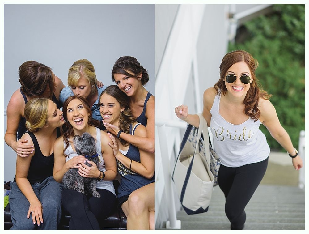 Group of women and a dog, smiling, in casual clothes; one woman climbing stairs carrying a bag.