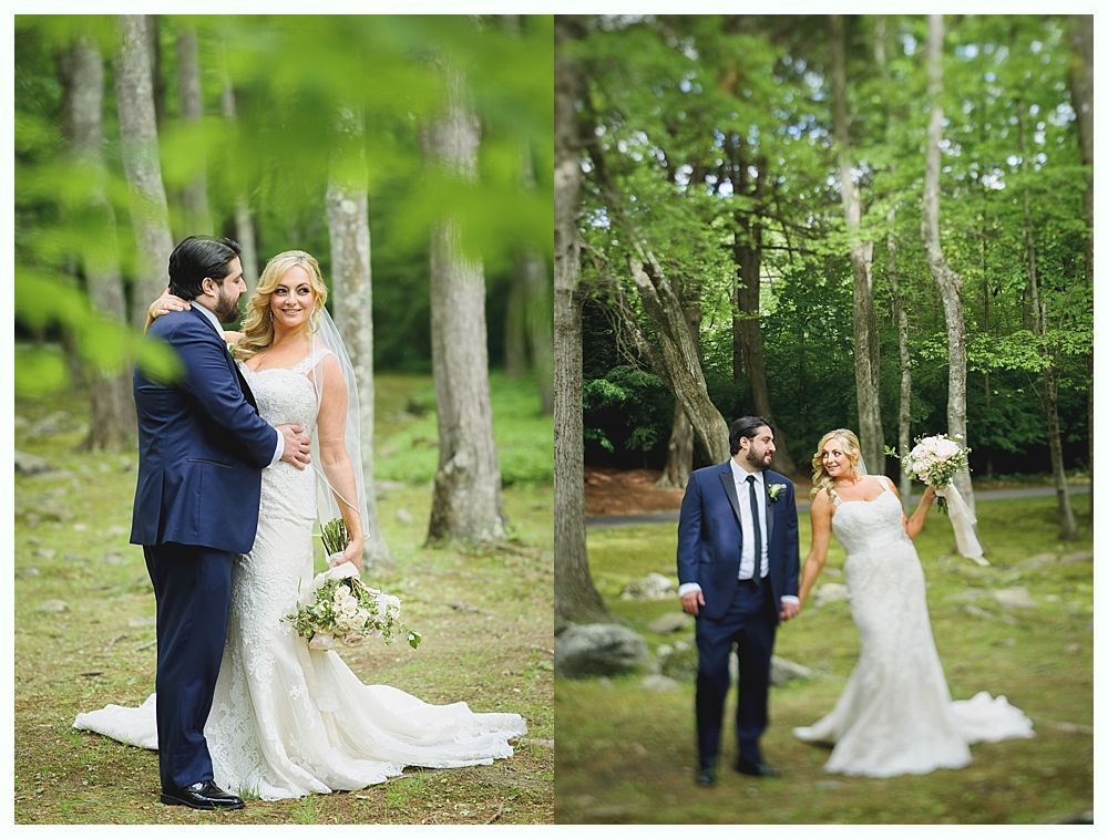 Bride and groom pose in a forest setting. The bride wears a white gown, and the groom is in a navy suit.