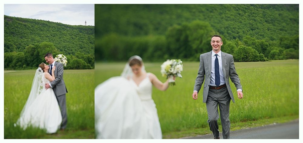 Wedding photos of a couple in a field. The bride and groom are in front of a green backdrop of hills and a road.
