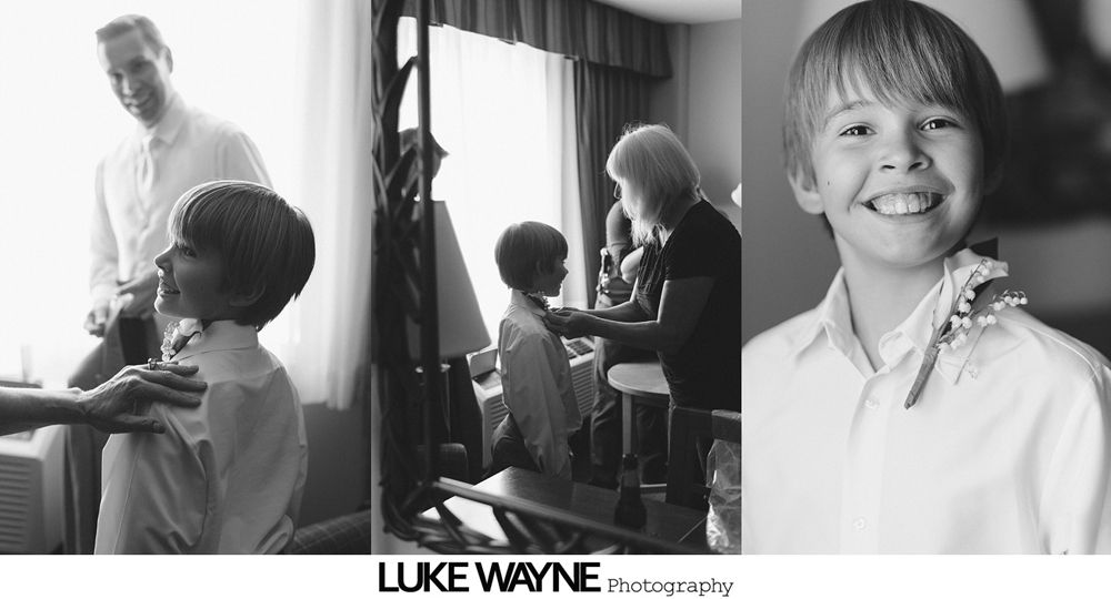 Three-panel black and white photo. A child is getting his clothes fixed by adults. He is smiling in the last panel.