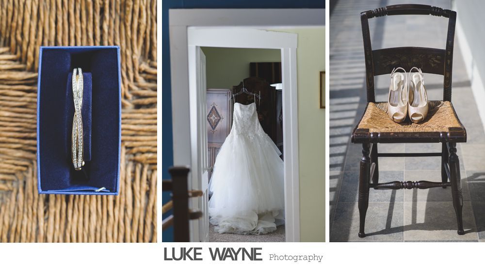 Wedding details: bracelet in box, dress in doorway, heels on chair.
