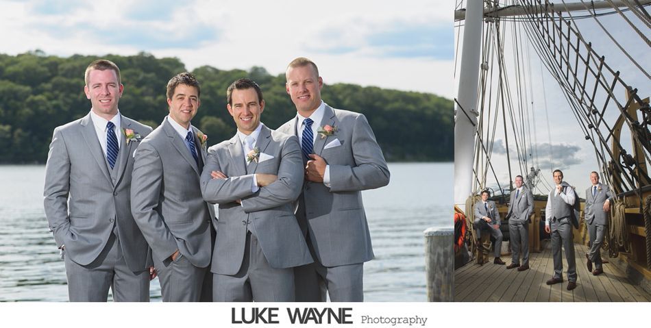 Groomsmen in gray suits pose by water, and on a ship deck.