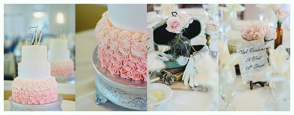Wedding cake with pink frosting, decorated table setting with flowers and signage.