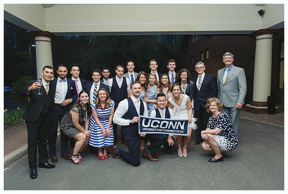 Group of people pose for a photo with a 