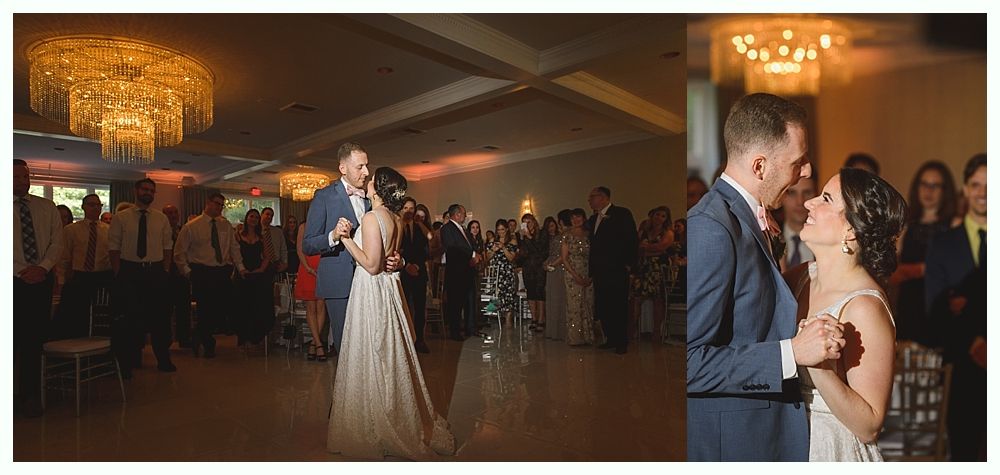 Newlyweds share a dance in a brightly lit ballroom; a large chandelier hangs above.