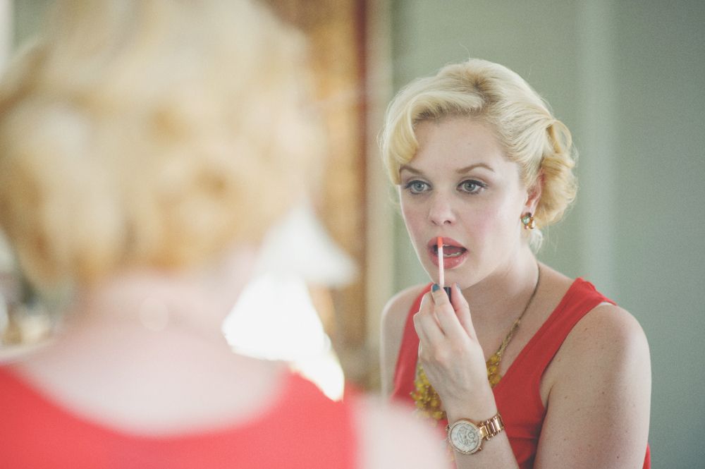 Wedding photos of a couple in a forest setting. The bride holds a sunflower bouquet. The groom kisses the bride.