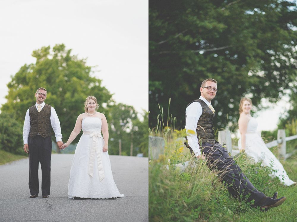 Couple kissing near trees at night with glowing streetlights in foreground.