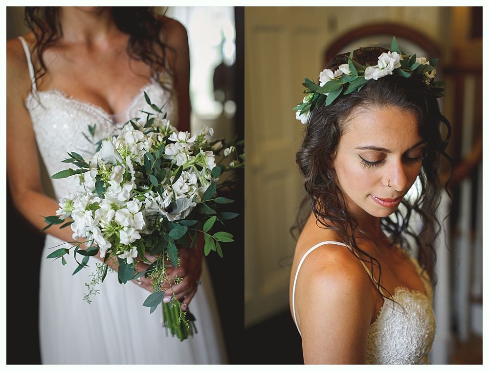 Bride in white dress holding bouquet and wearing floral crown.