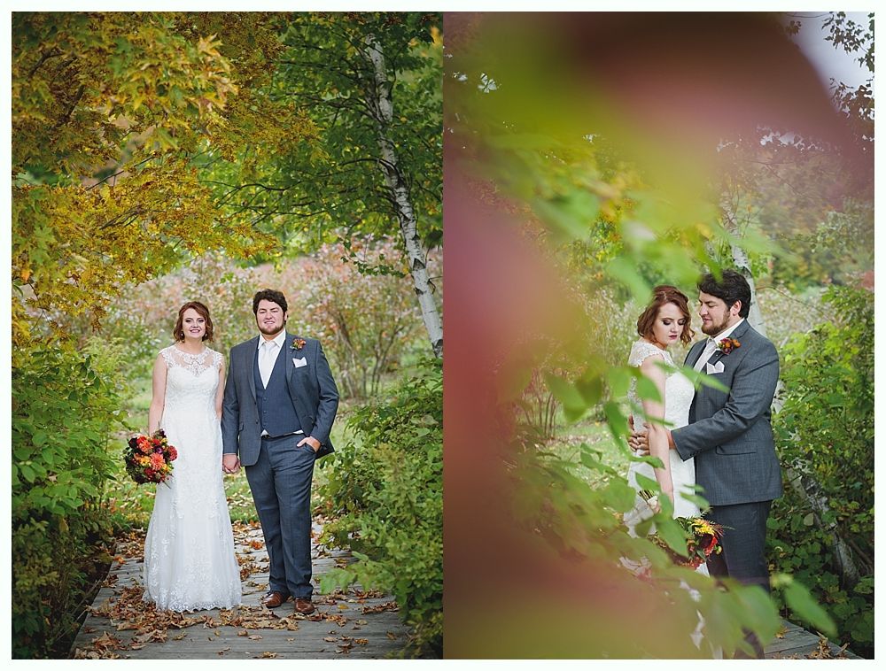 Wedding couple walking on a wooden path surrounded by autumn foliage; second image, couple hugging with blurry foreground.