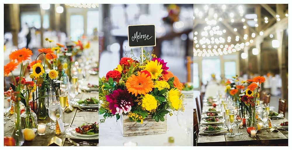 Wedding reception table setting with floral centerpieces, garlands, and string lights.