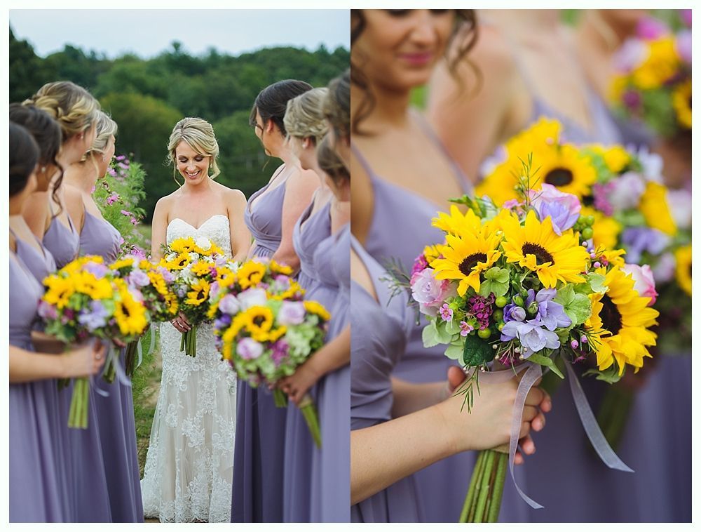 Wedding party stands in road. Bride and bridesmaids in gold, groomsmen in blue suits.