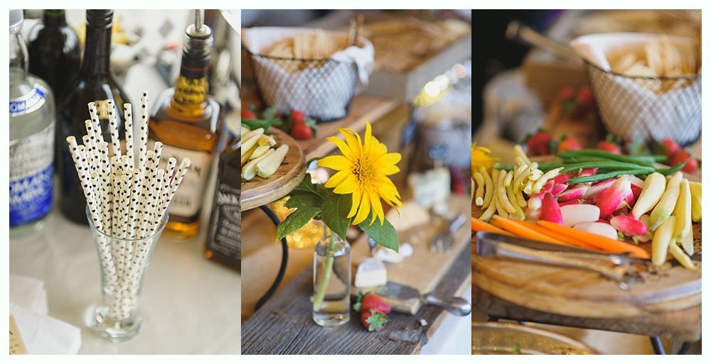 Bride and groom entering a reception, arms raised, smiling. Room with tables and windows.