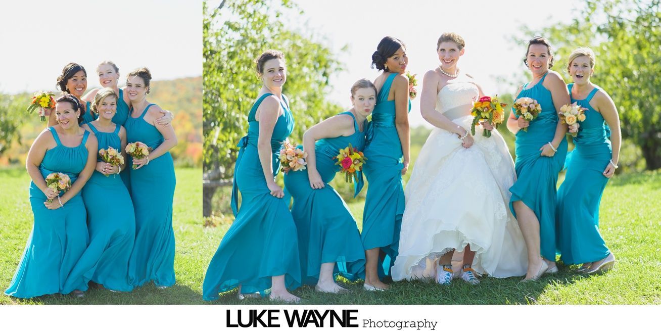 Bride with bridesmaids in teal dresses, posing outdoors. Some bridesmaids have playful expressions.