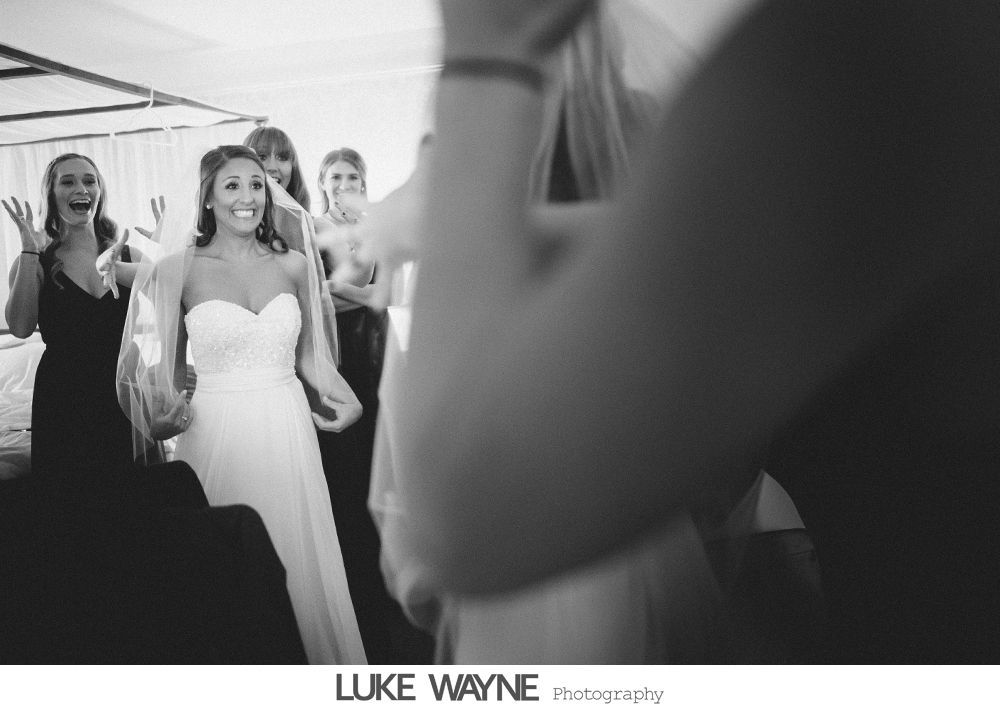 Wedding triptych: Bride and groom with purple accents, posing on a city street and doorway, smiling.
