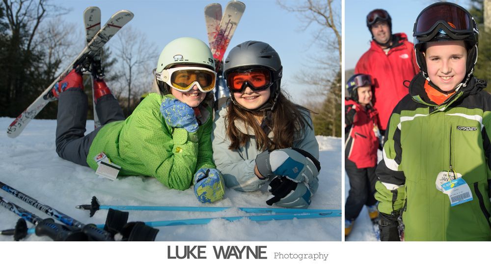 Jewelry arrangement: earrings, feather hair accessory, and a jeweled watch on a wooden surface.
