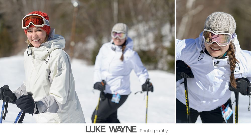 Wedding party on steps, bride in white dress, bridesmaids in purple dresses, groomsmen in gray suits.
