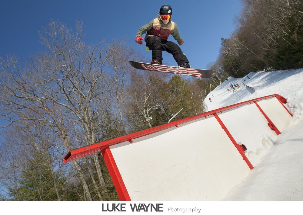 Bride and groom share a kiss and dance during a wedding. Black and white.